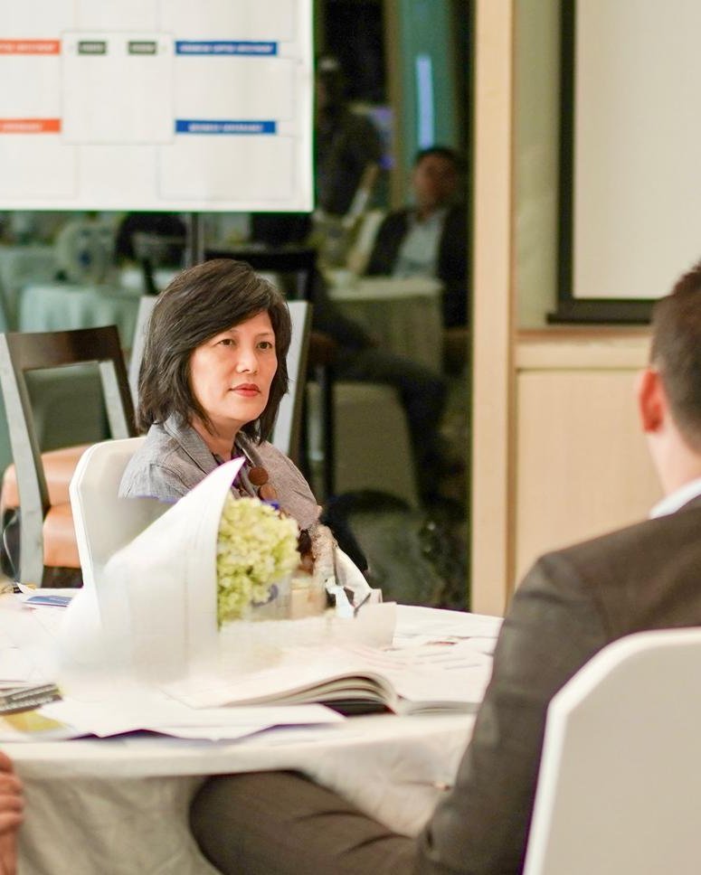 Keng-Fun Loh and Randel S. Carlock seated with participants at YPO Workshop in Jakarta 2019